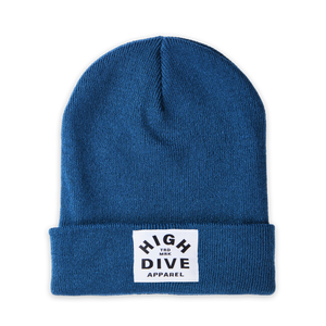 Gorro color petróleo con etiqueta HDA blanca